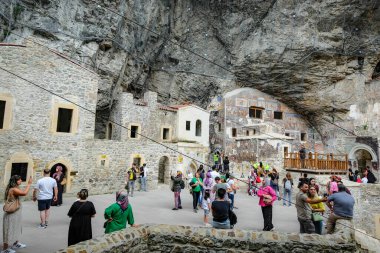 Macka, Turkey - July 26, 2024: People visiting Sumela Monastery, a Greek Orthodox monastery in Macka, Turkey. clipart