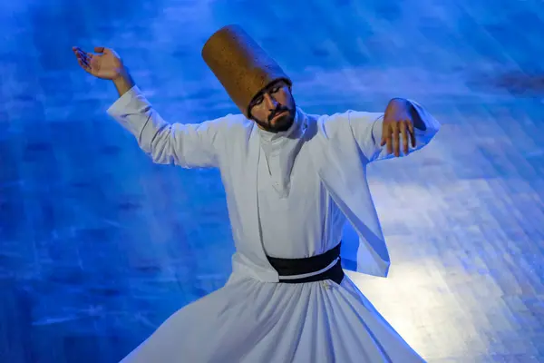 stock image Konya, Turkey - August 18, 2024: Whirling dervishes during a sufi whirling performance in Konya, Turkey.