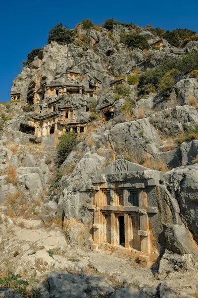 stock image Demre, Turkey - August 24, 2024: Rock-cut tombs in the ruins of Myra Ancient City in Demre, Turkey.