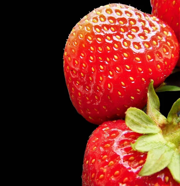 stock image Ripe strawberries on a black background