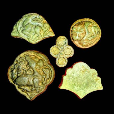 Ancient bronze jewelry molds in the animal style of the Scythians on an isolated black background clipart