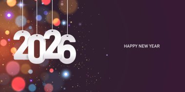 Mutlu yıllar 2026. Renkli, bulanık bir arkaplanda konfeti ile beyaz kağıt numarası asmak.