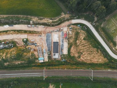 Asse, Belgium, September 5, 2024, Aerial drone photo of the bikers bridge under the railroad tracks. Photo taken during construction, before the final placement. clipart