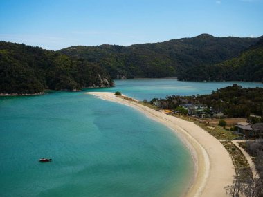 Elevated view of tropical pacific ocean beach surrounded by lush green nature in Abel Tasman National Park South Island New Zealand