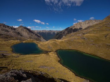 Southern Alps mountain panorama of scenic alpine Hinapouri tarn lake in Nelson Lakes National Park, Tasman South Island New Zealand