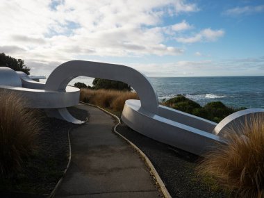 Pedestrian walkway through giant oversized silver anchor chain art sculpture at Stirling Point Bluff Invercargill Southland South Island New Zealand