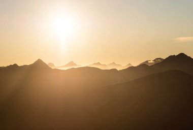 Alpine sunset mountain silhouette layers, nature landscape panorama seen from Mount Armstrong Brewster Hut West Coast Otago Southern Alps South Island New Zealand