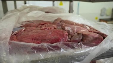 A close-up of fresh raw beef meat lies on the counter. Meat shop