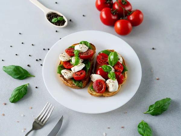 Toast Mozzarella Cheese Tomatoes Basil Leaves Light Background Italian Food — Stock Photo, Image