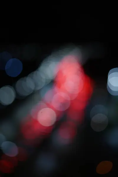 Blurred background of a Car Traffic jam in a night city. Defocussed city traffic jam