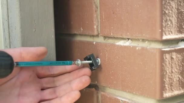 Construction Worker Tightens Screws Using Electric Drill — Stock Video