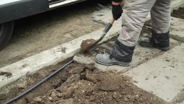Worker Digs Electric Wires Ground Shovel Man Digs Ditch Ground — Stock Video