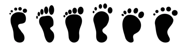 黑色的人类脚印在白色背景上孤立的向量图 — 图库矢量图片