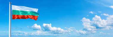 Bulgaria Flag - state of Europe, flag waving on a blue sky in beautiful clouds - Horizontal banner
