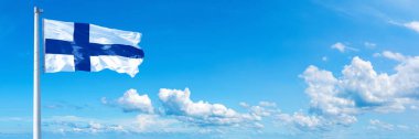 Finland Flag - state of Europe, flag waving on a blue sky in beautiful clouds - Horizontal banner