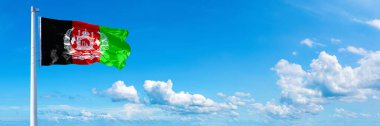 Afghanistan Flag (1931-1973), flag waving on a blue sky in beautiful clouds - Horizontal banner