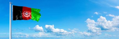 Afghanistan Flag (2002-2004), flag waving on a blue sky in beautiful clouds - Horizontal banner