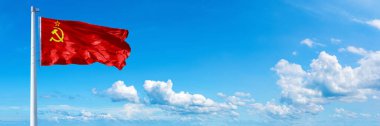 Soviet Union Flag - state of Europe, flag waving on a blue sky in beautiful clouds - Horizontal banner