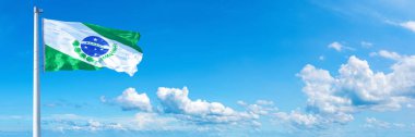 Paran flag - state of Brazil, flag waving on a blue sky in beautiful clouds - Horizontal banner