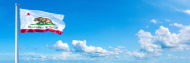 California flag - state of USA, flag waving on a blue sky in beautiful clouds - Horizontal banner