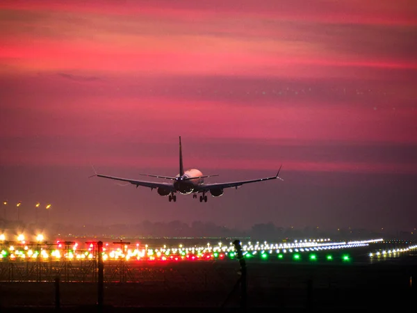 Airplane landing and landing lights at Barcelona airport, Spain