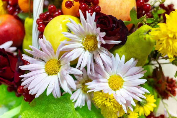 stock image White flowers and various fruits close-up. Selective focus.