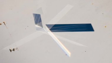 Timelapse in 4K of the decomposition of sunlight in the colors of the rainbow through a prism taking advantage of the rotation of the earth and the colors disappearing at the end of the video
