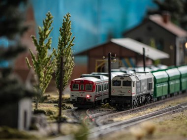 Ponferrada, Leon, Spain; 10-20-2024: Two locomotives from the Renfe and Renfe freight companies wait at the exit of a station just before the picket line at a model railway exhibition clipart