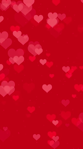 抽象浪漫的垂直视频背景 动画心形的彩霞粒子在鲜红的背景下脉动 浪漫爱情派对或情人节的精美的节日动画 — 图库视频影像