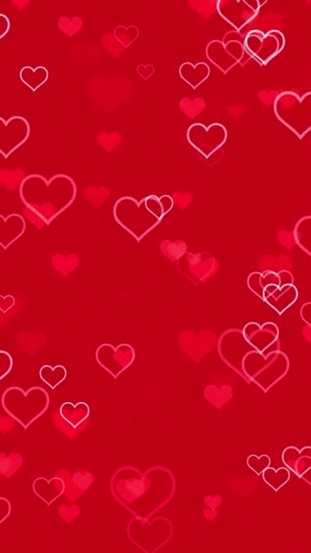 抽象的なロマンス 赤い背景で脈動するアニメーションの明るい心臓の形状の粒子を持つ垂直動きの背景 ロマンチックな愛のパーティーやバレンタインデーのための装飾的なシンプルなビデオアニメーション — ストック動画