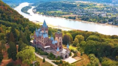 Aerial view of the Drachenburg castle and the river Rhine