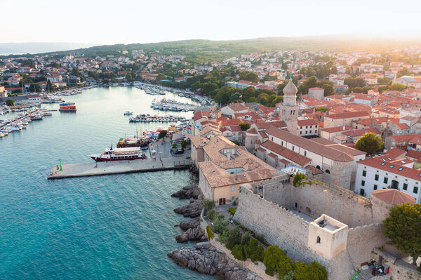 Aerial View of Coastal City Krk with Harbor and Red-Tiled Roofs