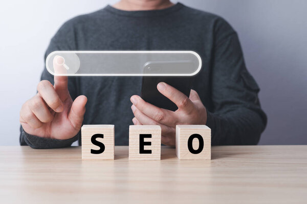 Searching Browsing Internet Data Information with blank search bar. hand of businessman working with smartphone . Search Engine Optimization SEO Networking Concept.
