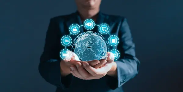 stock image A person holding world and plan in e-business, the use of online digital network technology in business, buying and selling commerce online digital marketplace