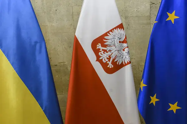 National flags of Ukraine and Poland and the flag of the European Union. High quality photo