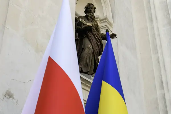National flags of Ukraine and Poland during commemorating the victims of the Volyn tragedy at the Saint Peter and Paul Cathedral in Lutsk, Ukraine. High quality photo