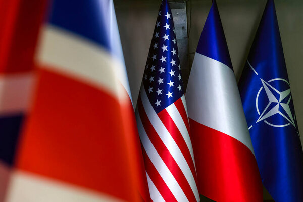 Flags of the United Kingdom, the United States, France and NATO at a diplomatic event in Kyiv, Ukraine June 19, 2024. High quality photo
