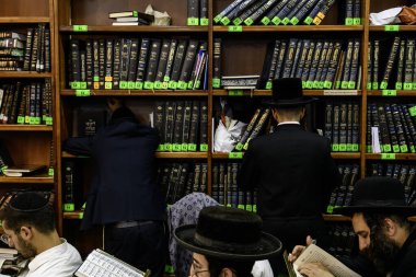 Ultra-Orthodox Jewish Hasids pilgrims pray near the tomb of Rabbi Nachman on the eve of Rosh Hashanah holiday, Jewish New Year, amid Russia continues the war in Ukraine. Uman, Ukraine 15-09-2023 clipart