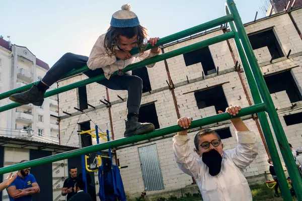 stock image Children, ultra-Orthodox Hasidic Jewish pilgrims, play in street near tomb of Rabbi Nachman on the eve of Rosh Hashanah holiday, Jewish New Year, amid Russia continues war in Ukraine. Uman 17-09-2023