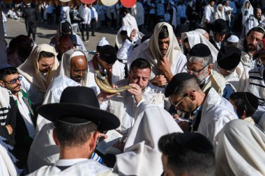 Ultra-Orthodox Jewish Hasids pilgrims pray in Synagogue of Bratslav Hasidim close to tomb of Rabbi Nachman on the eve of Rosh Hashanah holiday, Jewish New Year, in Uman, Ukraine 17-09-2023.  clipart