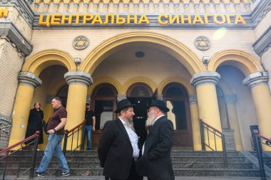 Jewish worshippers chatting at the entrance to the Central Synagogue in Kyiv, Ukraine, September 12, 2024. High quality photo clipart