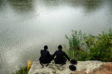 Orthodox Jewish pilgrims pray on the bank of lake near the tomb of Rabbi Nachman while celebrating Rosh Hashanah, Jewish New Year, amid Russia continues the war in Ukraine. Uman, Ukraine 15-09-2023.  clipart