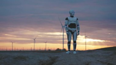 Gelecek şimdidir. Otomatik Sayborg İnsansı Robot Boş Çöl Arazisinde Yürüyor. Eko Rüzgâr İstasyonu Arkaplanlı Gelecekçi Çevre. Al Kavramı.