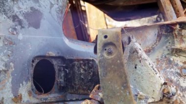 A lot of rusty burnt cars in the city of Irpin. War of Russia against Ukraine. Destroyed cars of civilians who were evacuated from the combat zone. The result of a fire. Auto insurance concept
