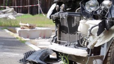Black car after a terrible accident on the side of the road. Frontal and side impact. Life insurance. An accident without the possibility of recovery. Side view. Damage after an accident