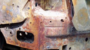 Broken and burned cars in the parking lot, accident or deliberate vandalism. Burnt out car. Consequences of a car accident. Damaged by arson. Dump of civilian equipment, shot in Ukraine