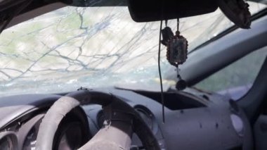The icon amulet in the car of Nicholas the Wonderworker on a cord. The badge hangs conveniently on the rear-view mirror in the car. Translation: Seraphim of Sarov the Wonderworker