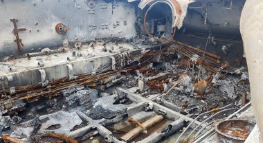 Destroyed Russian military equipment, destroyed armored car. War in Ukraine. Fragment of a rusty burnt car. Salon armored car armored personnel carrier. Remains of military equipment