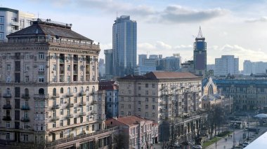 Top view of Khreshchatyk street and Independence Square in the city of Kyiv, the capital of Ukraine during the day. Pan. City life on Central Square. Ukraine, Kyiv - January 2, 2024 clipart