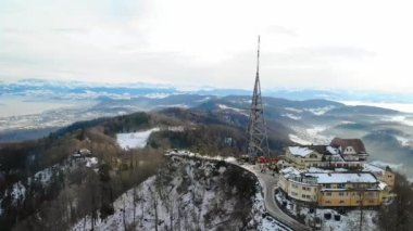 Drone view of observation tower Uetliberg and visitor at late afternoon in winter time on top of zurich.